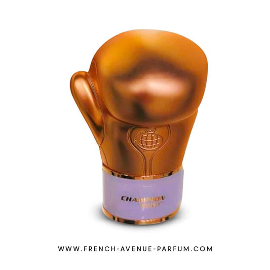 Gold boxing glove-shaped perfume bottle with a white base on a white background